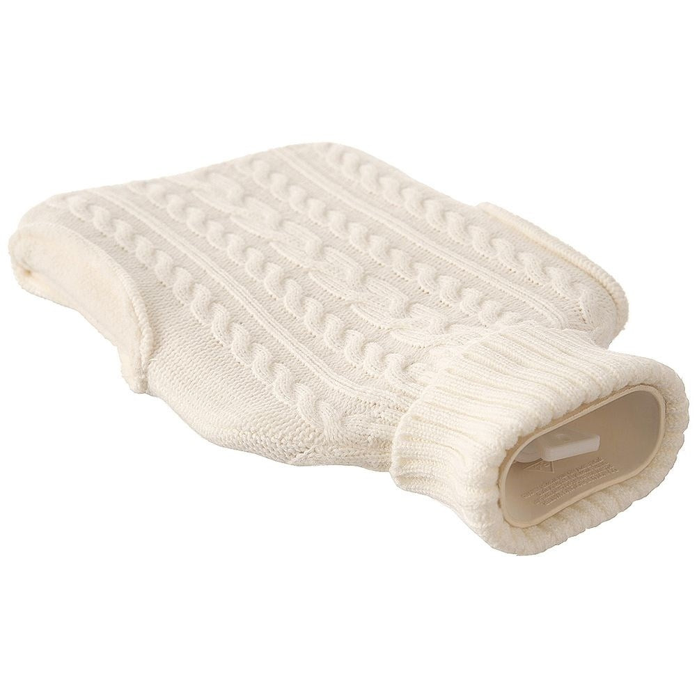 Heating bottle with cozy knitted beige cover