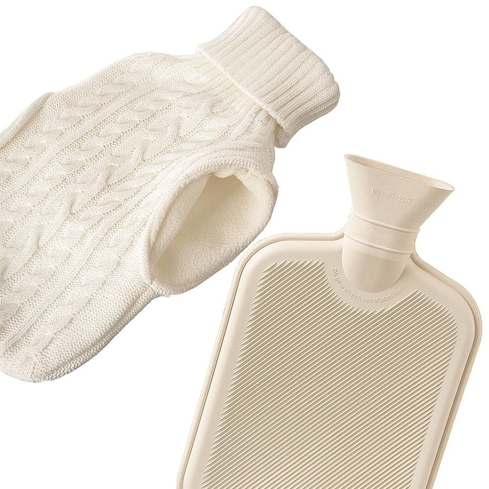 Heating bottle with cozy knitted beige cover