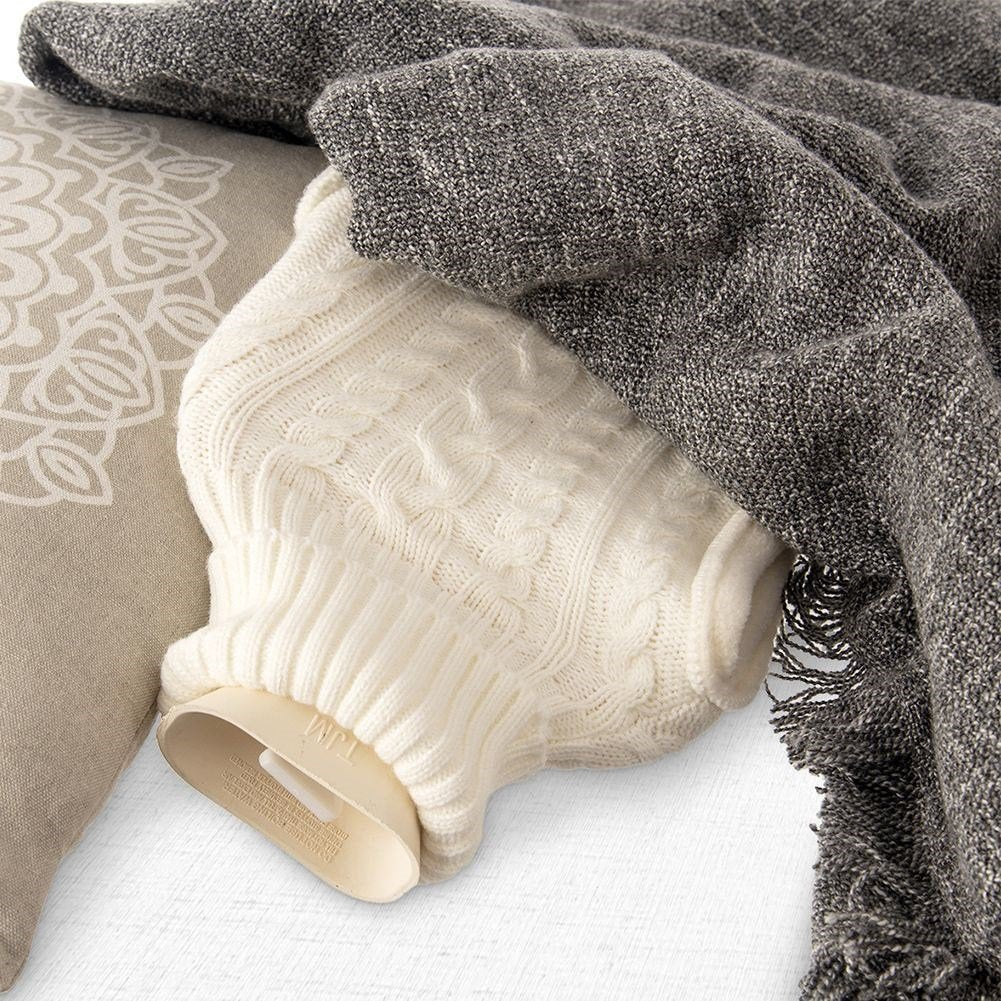 Heating bottle with cozy knitted beige cover