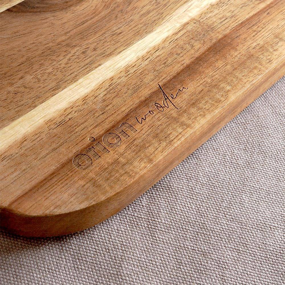 High-quality cutting board in acacia wood with handle