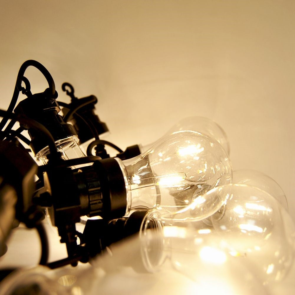 Indoor and outdoor garland with warm light bulbs