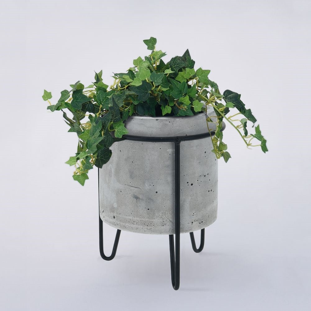 Industrial concrete pot with black metal stand