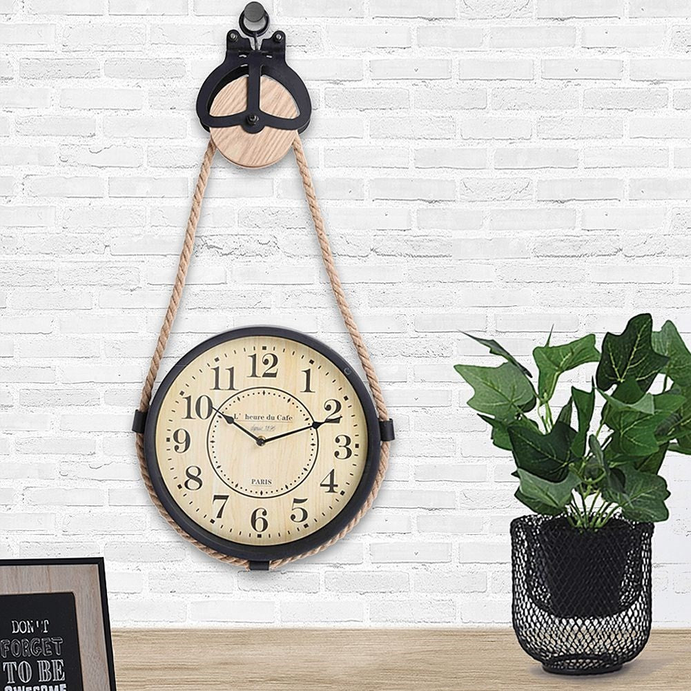 Industrial wall clock with rope suspension for modern interior design
