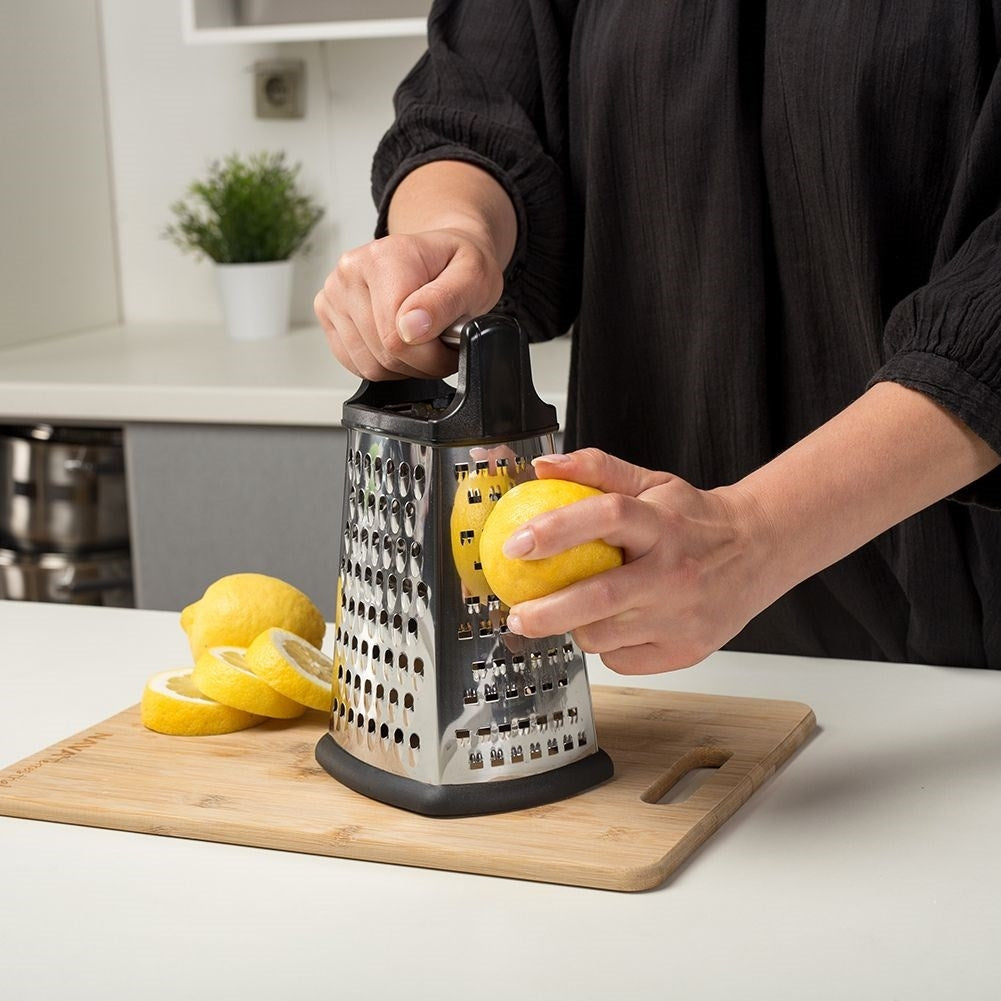 Kitchen grater with 4 blades for vegetables, cheese and spices