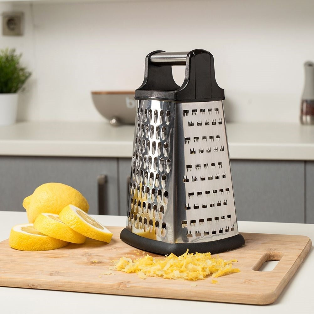 Kitchen grater with 4 blades for vegetables, cheese and spices