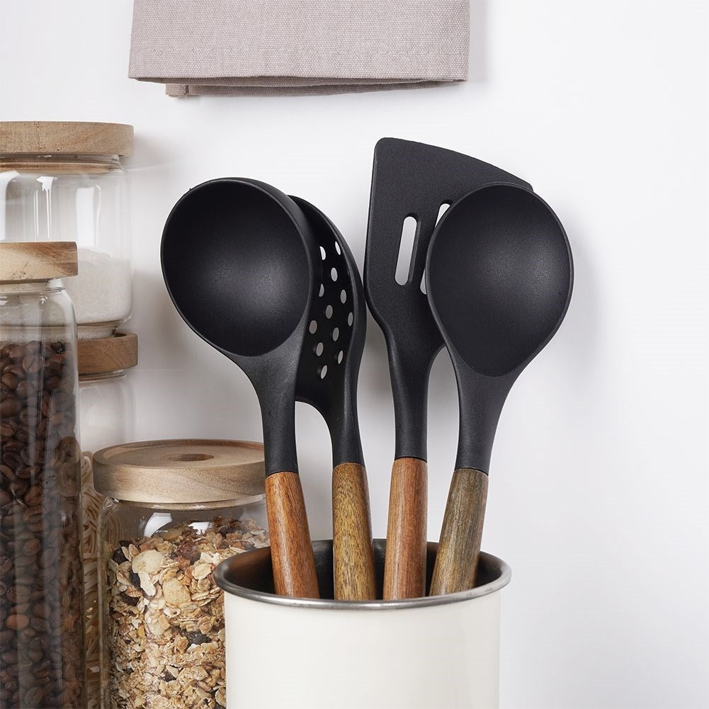 Kitchen spoon in acacia wood and thermoplastic for cooking