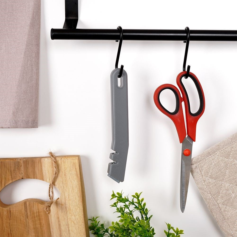 Knife and scissor sharpener with extra sharpening stone in stainless steel