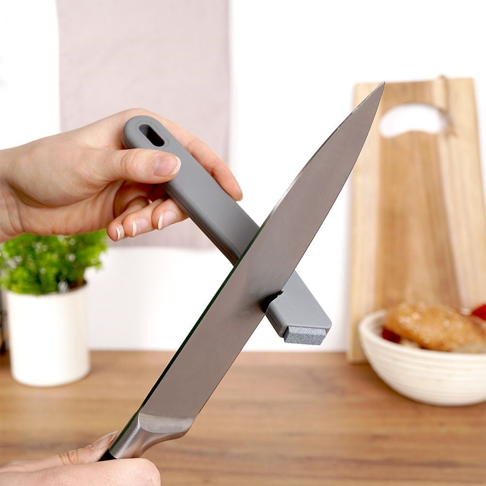 Knife and scissor sharpener with extra sharpening stone in stainless steel