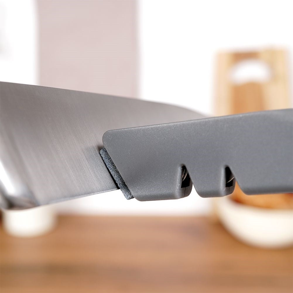 Knife and scissor sharpener with extra sharpening stone in stainless steel