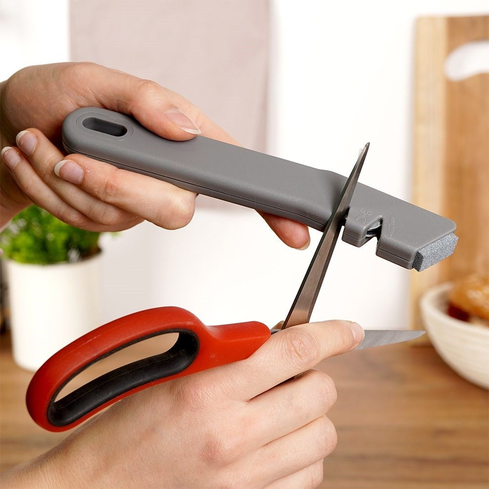 Knife and scissor sharpener with extra sharpening stone in stainless steel