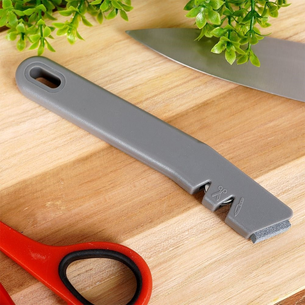 Knife and scissor sharpener with extra sharpening stone in stainless steel