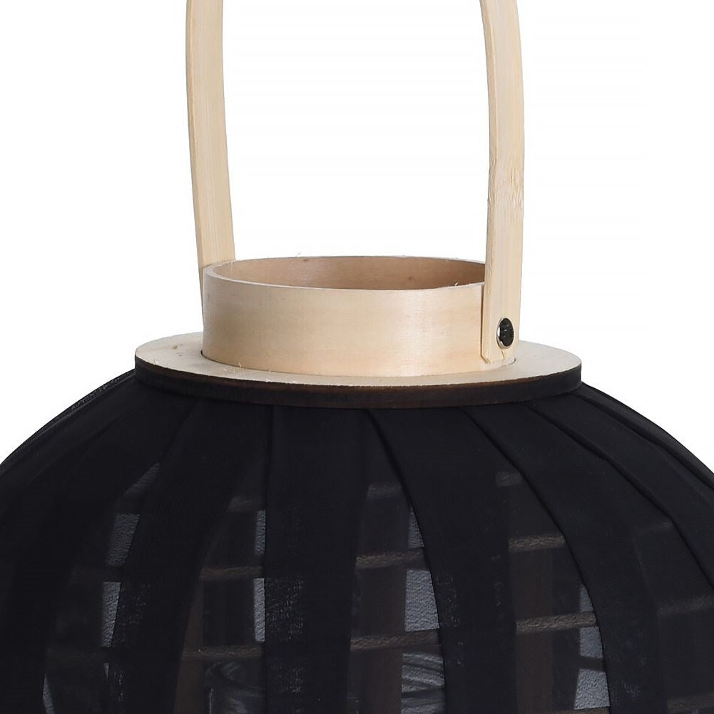 Lantern on a wooden stand with black fabric and glass inlay