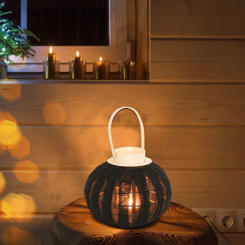 Lantern on a wooden stand with black fabric and glass inlay