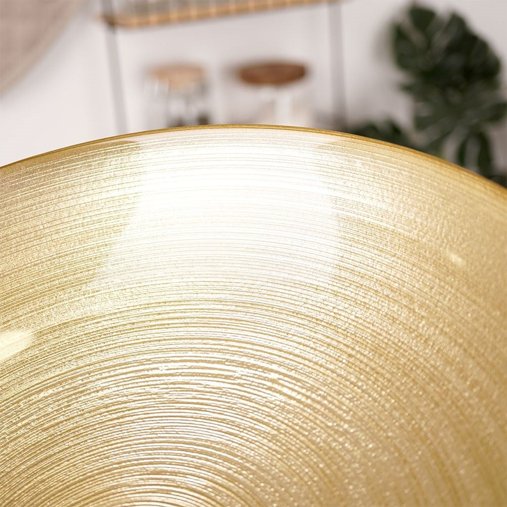 Large golden glass bowl for salad and serving