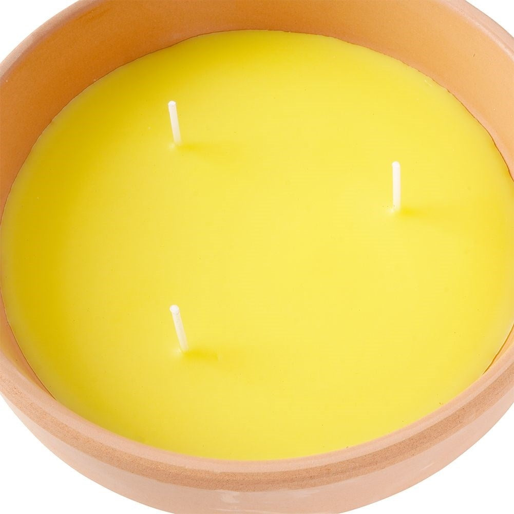 Lemon candle with three wicks in terracotta pot