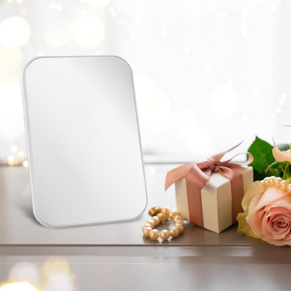 Makeup mirror on stand with white frame for makeup