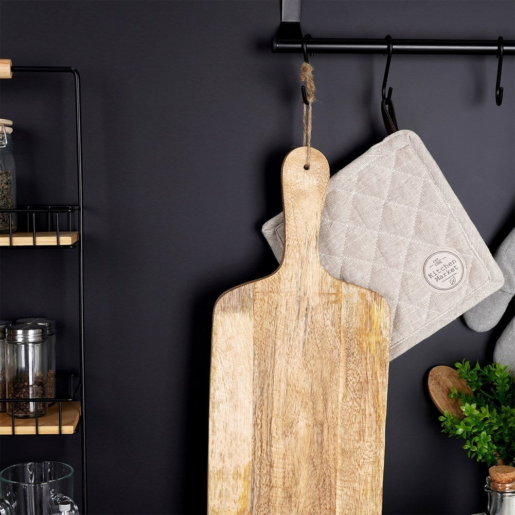 Mango wood cutting board with handle, perfect for serving.