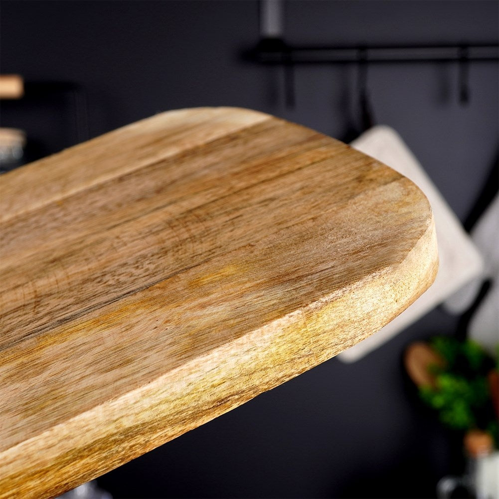 Mango wood cutting board with handle, perfect for serving.