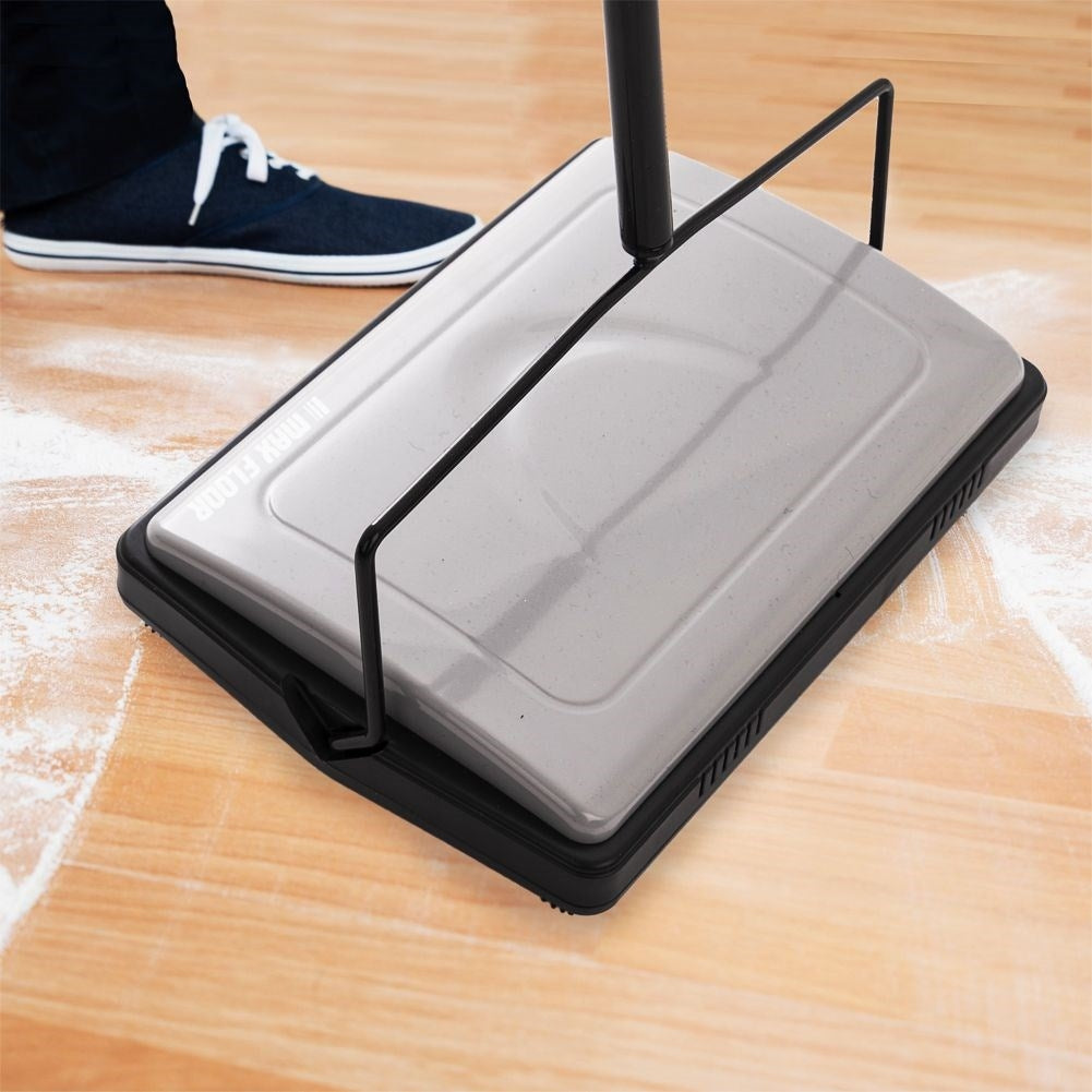 Mechanical vacuum cleaner with rotating brushes for all floors