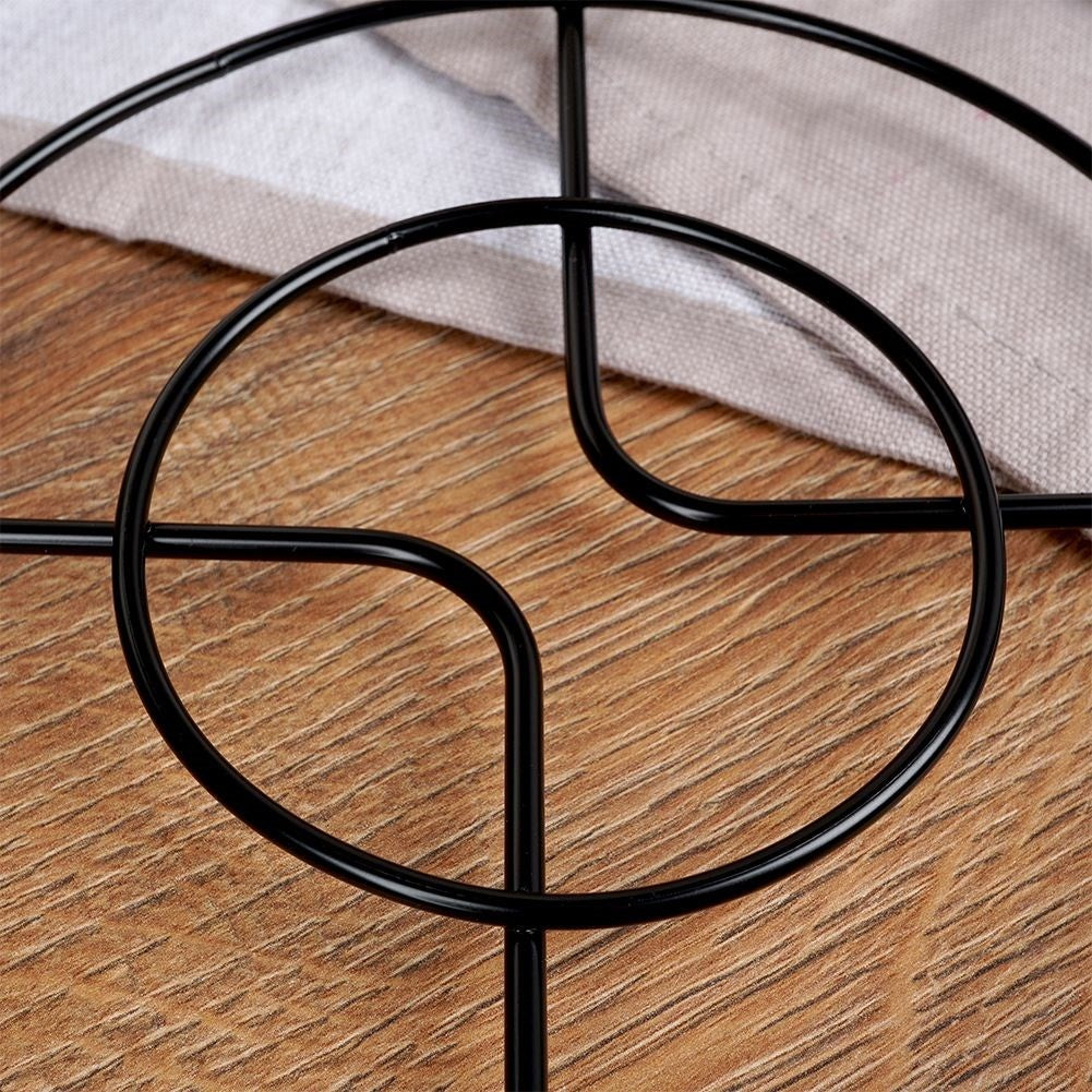 Metal coasters protect tables from hot pots and pans