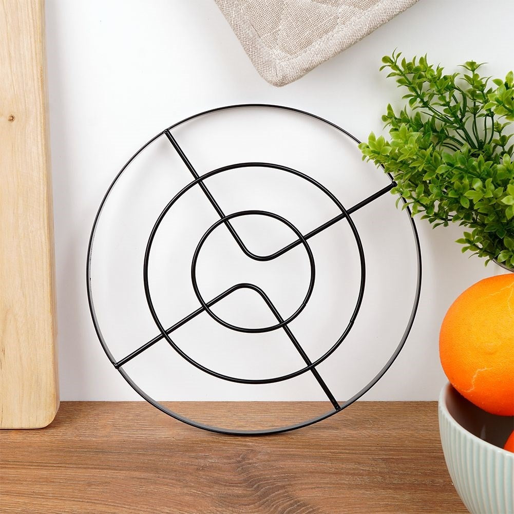 Metal coasters protect tables from hot pots and pans