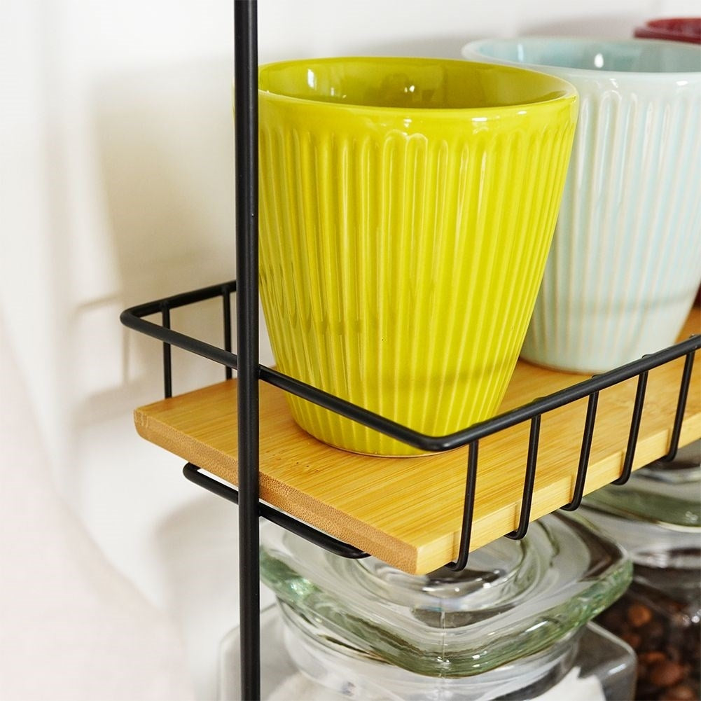 Metal construction kitchen shelf with wooden shelves and handles