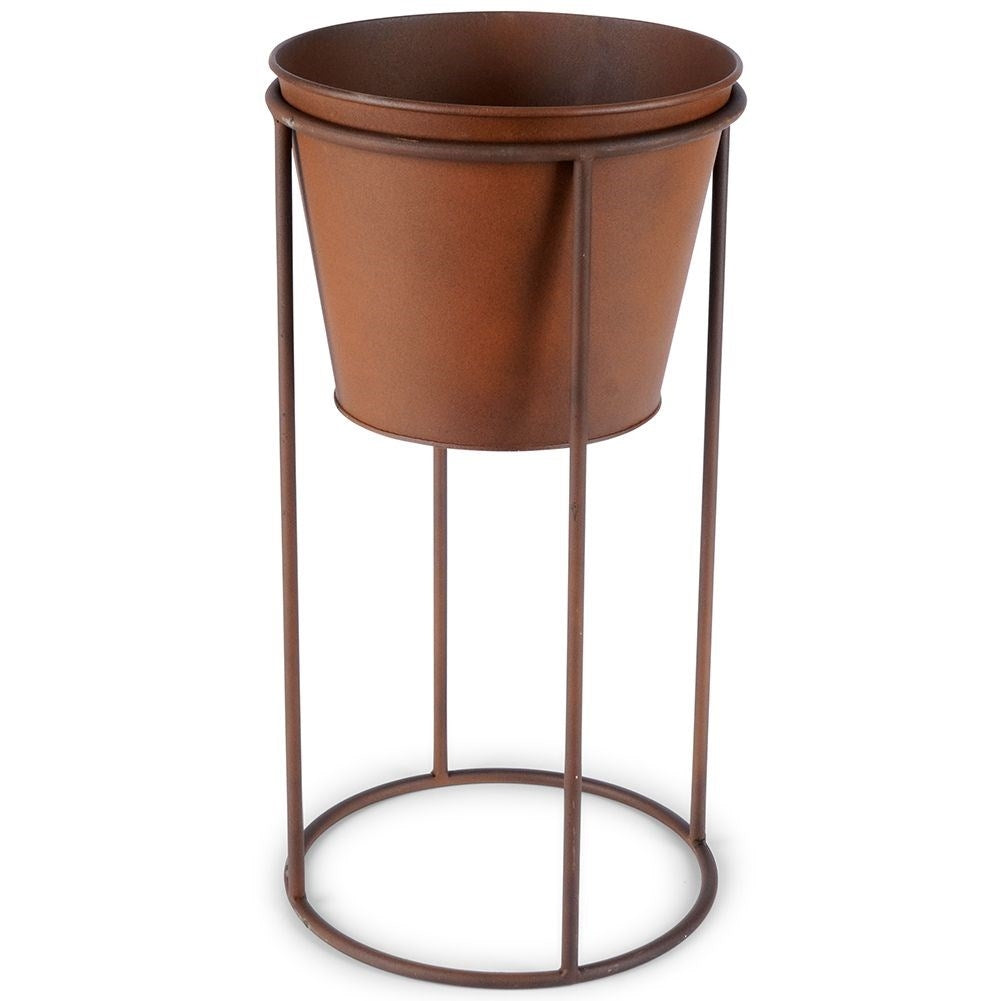 Metal flower pot on stand with rust effect