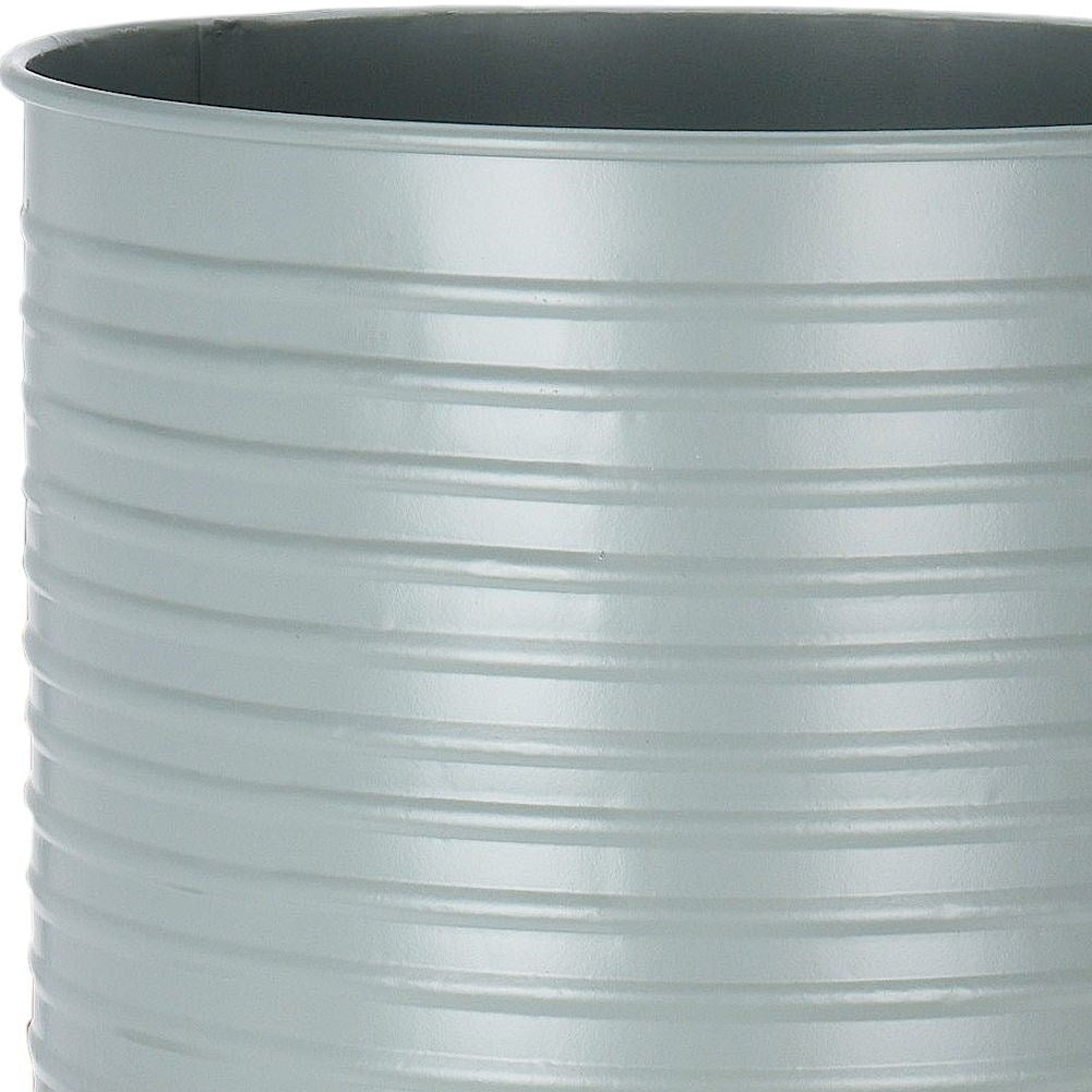 Metal flower pot with wooden stand for modern interior design