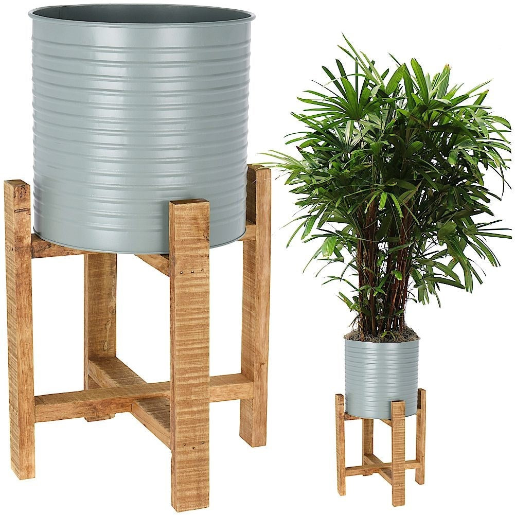 Metal flower pot with wooden stand for modern interior design