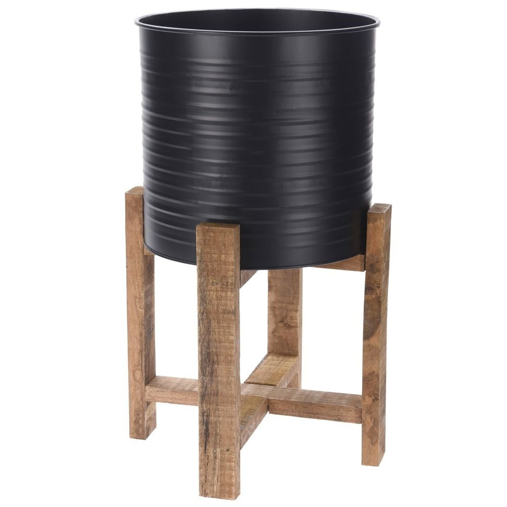 Metal flower pot with wooden stand for modern interior design