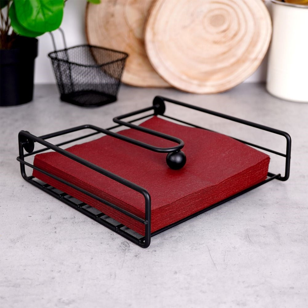 Metal napkin holder with firm grip and pressure function