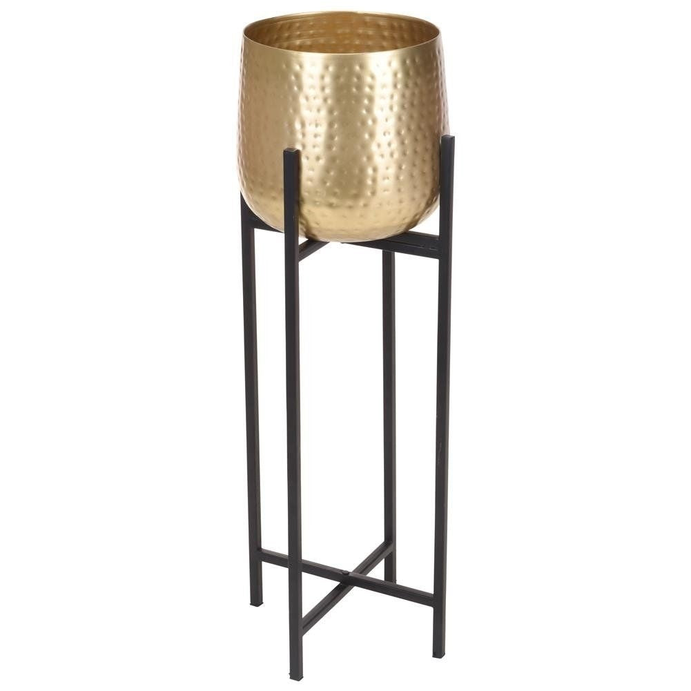 Metal pot on stand in black and gold color