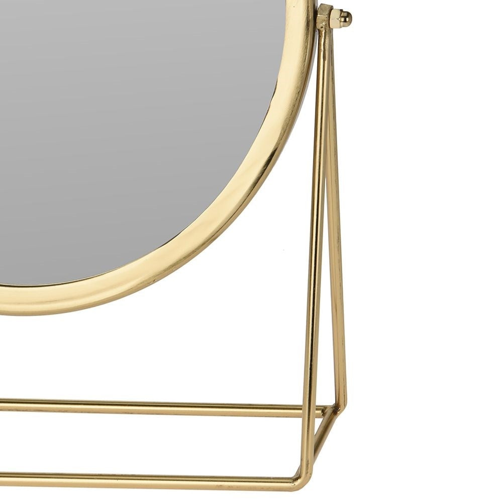Mirror with gold metal frame for make-up and beauty care