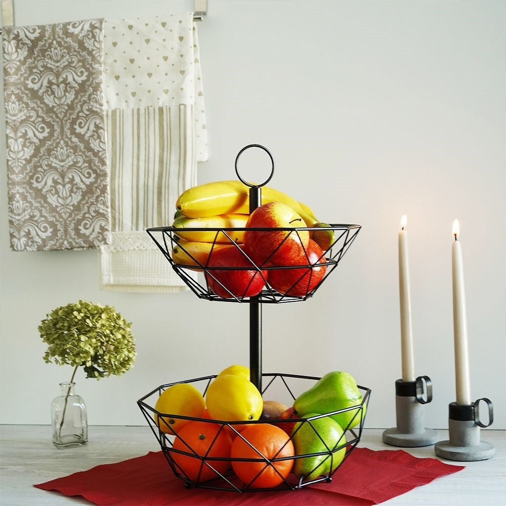 Modern two-level fruit basket in black metal for kitchen