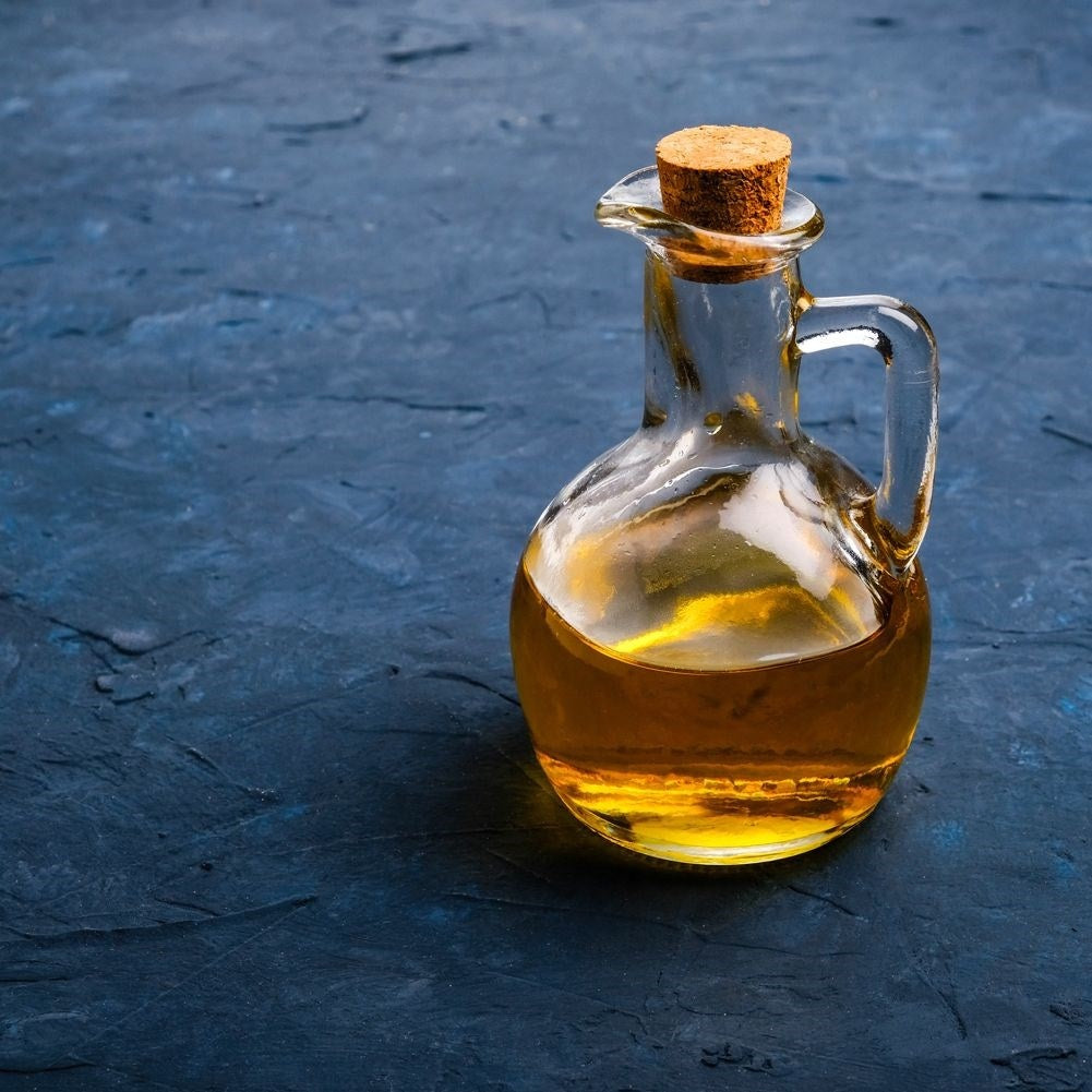 Oil bottle for serving with garlic, herbs and chilli