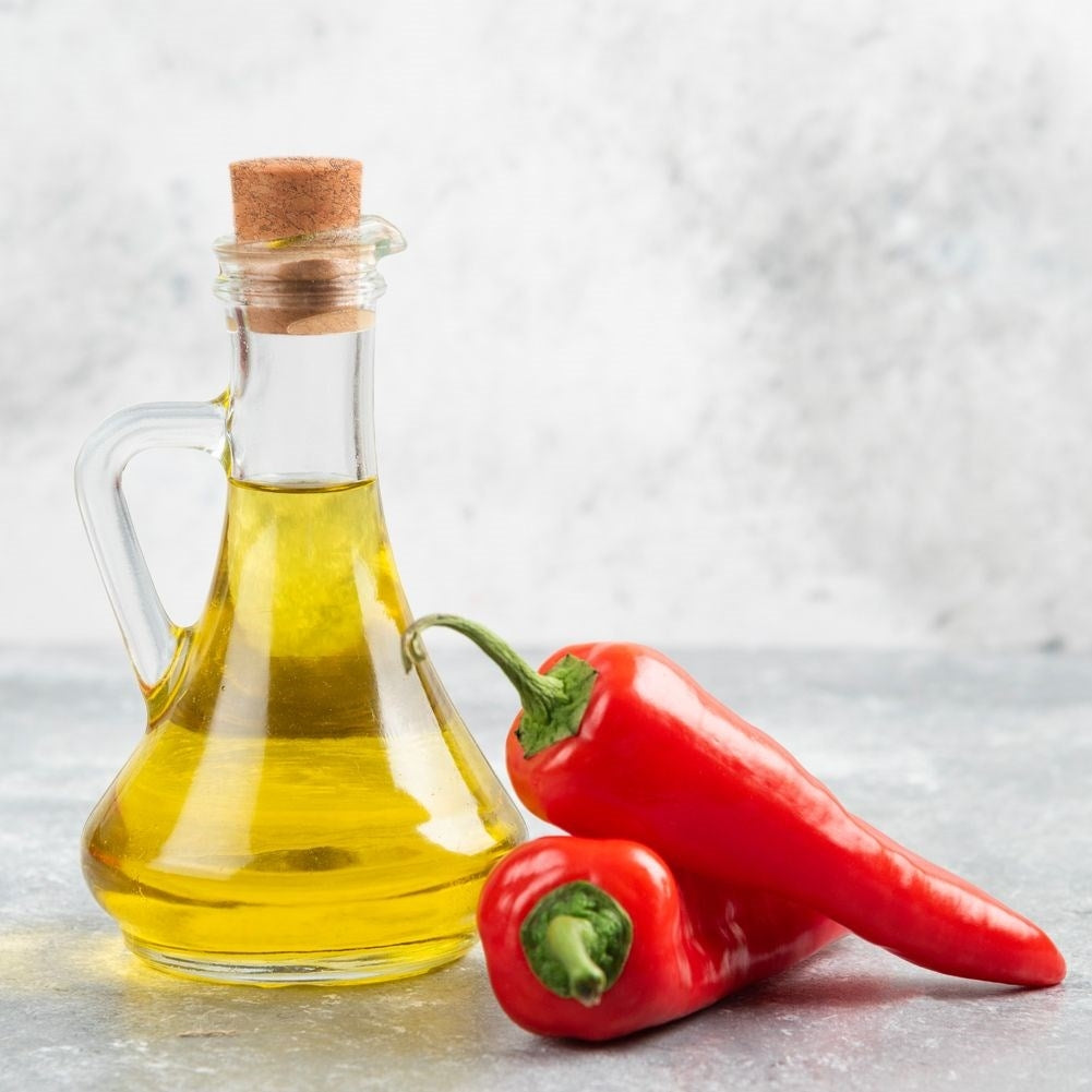 Oil bottle for serving with garlic, herbs and chilli