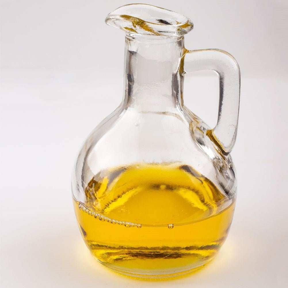 Oil bottle for serving with garlic, herbs and chilli