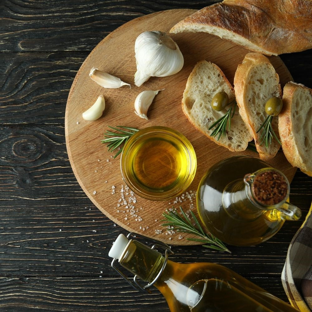 Oil bottle for serving with garlic, herbs and chilli