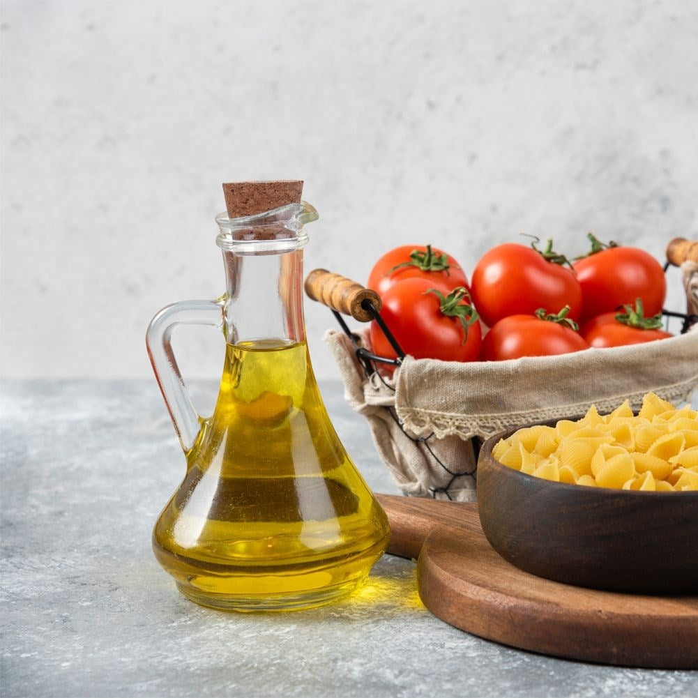 Oil bottle for serving with garlic, herbs and chilli