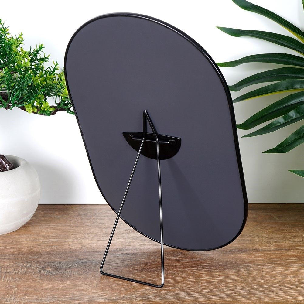 Oval make-up mirror with sturdy metal base and frame