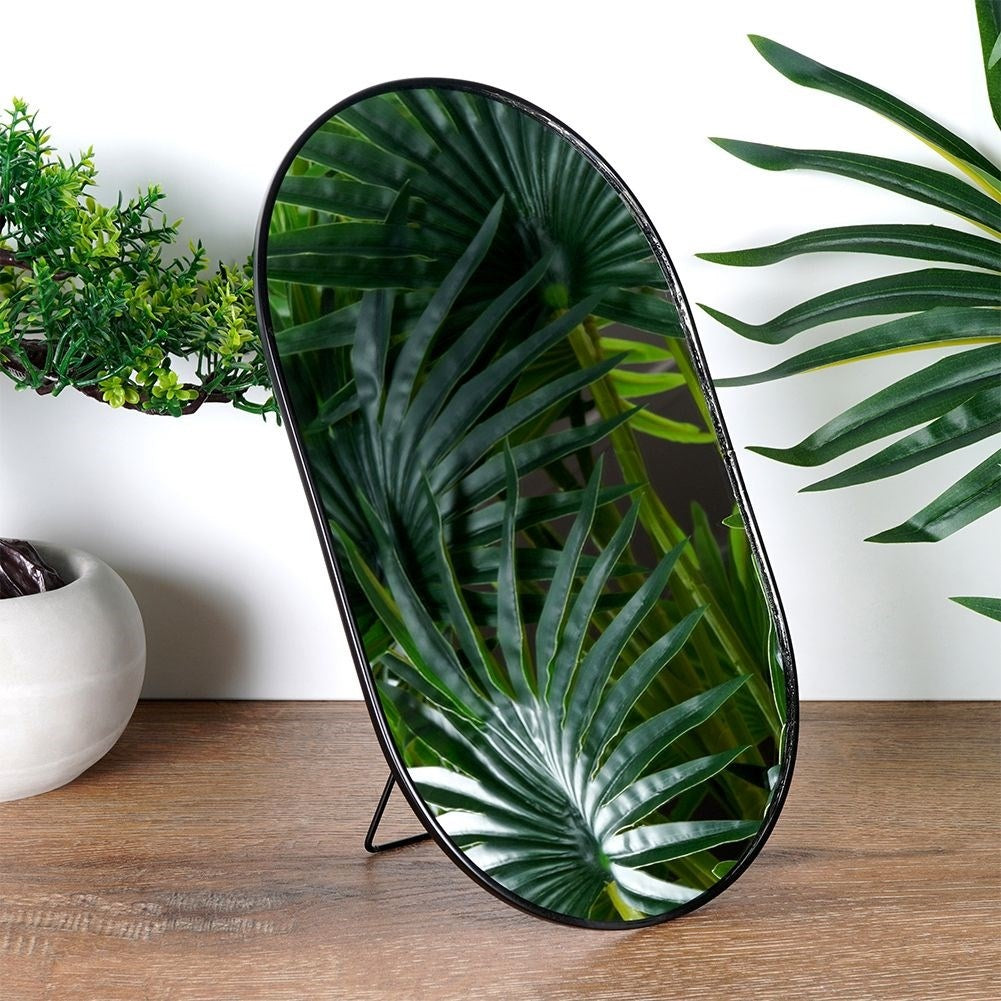 Oval make-up mirror with sturdy metal base and frame