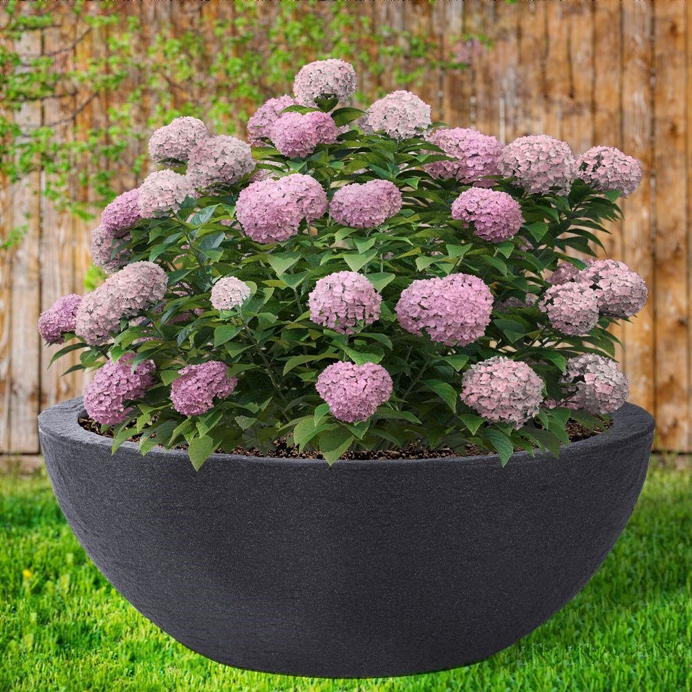 Oval weatherproof plastic pot imitating stone for outdoor use