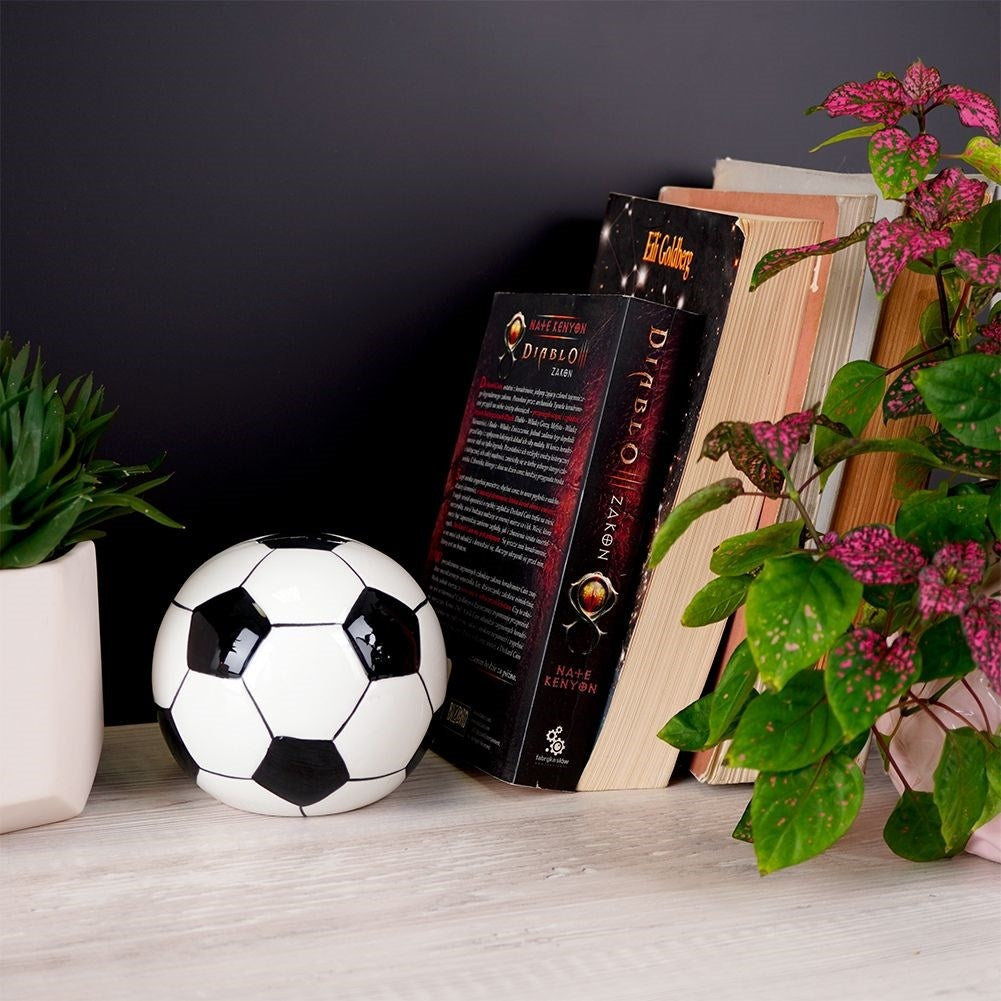 Piggy bank in ceramic shaped like a soccer ball