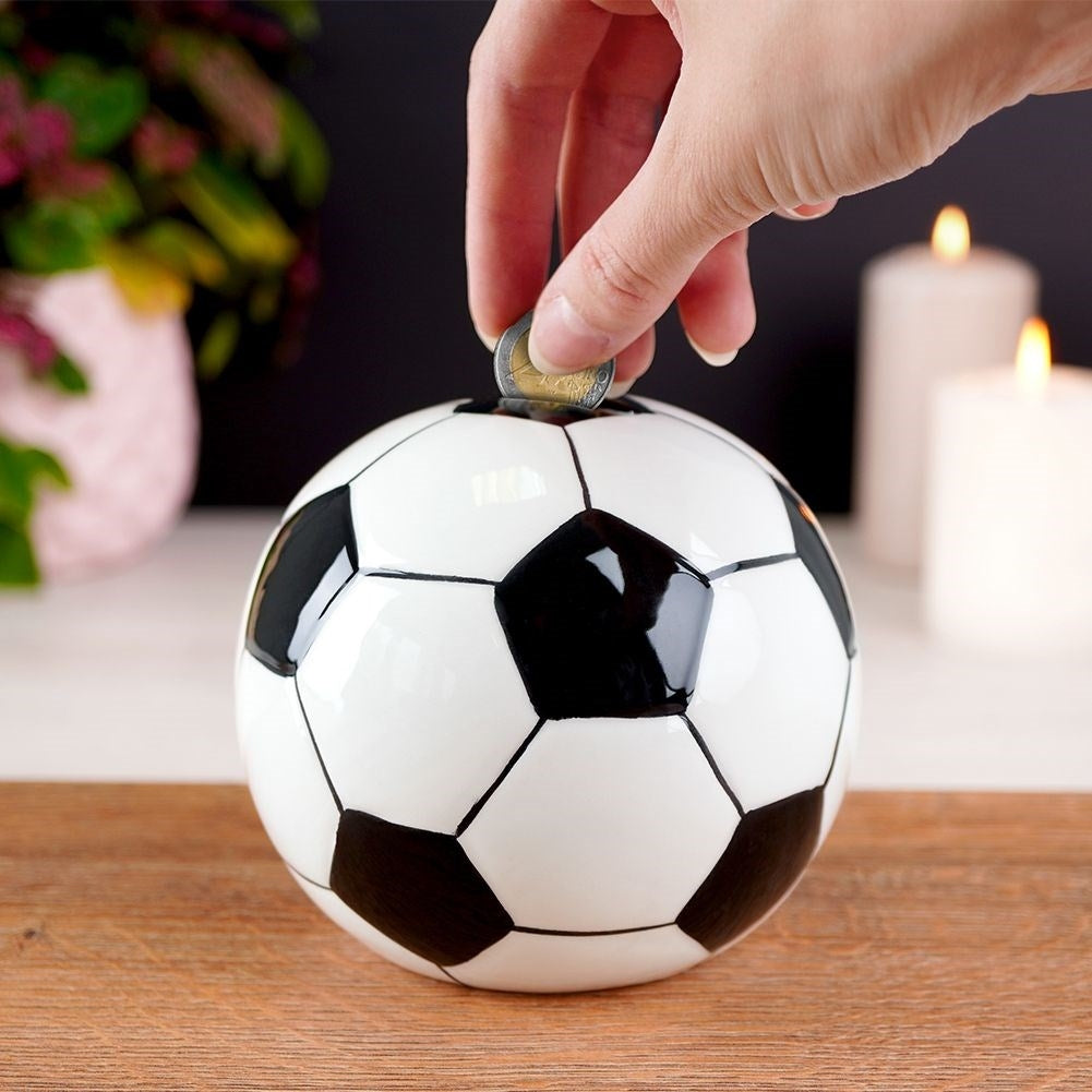 Piggy bank in ceramic shaped like a soccer ball