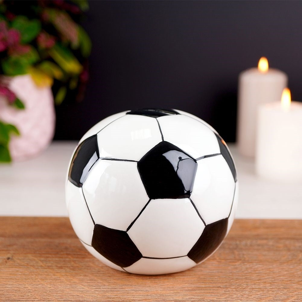 Piggy bank in ceramic shaped like a soccer ball