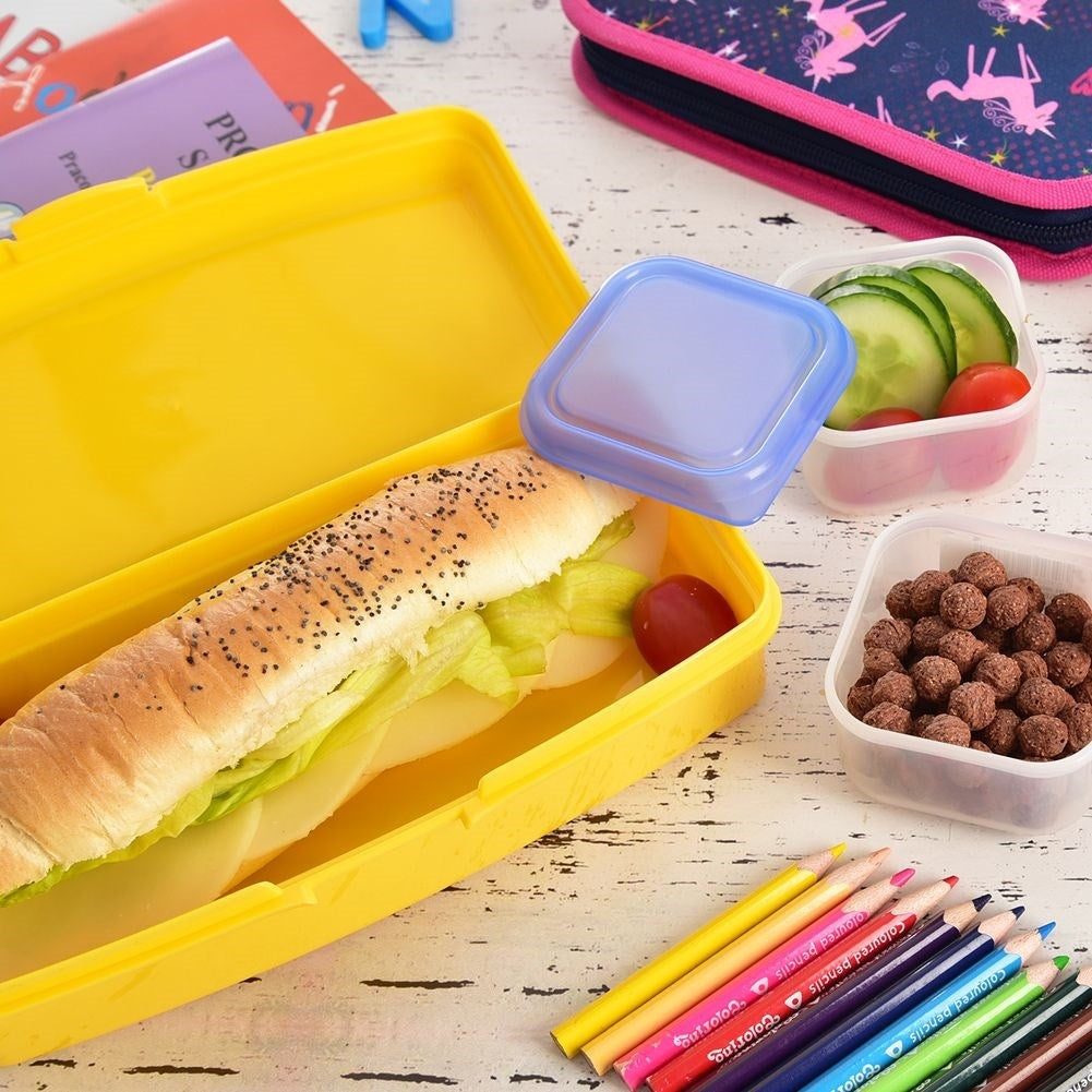 Pink lunch box with clip closure and cake motif