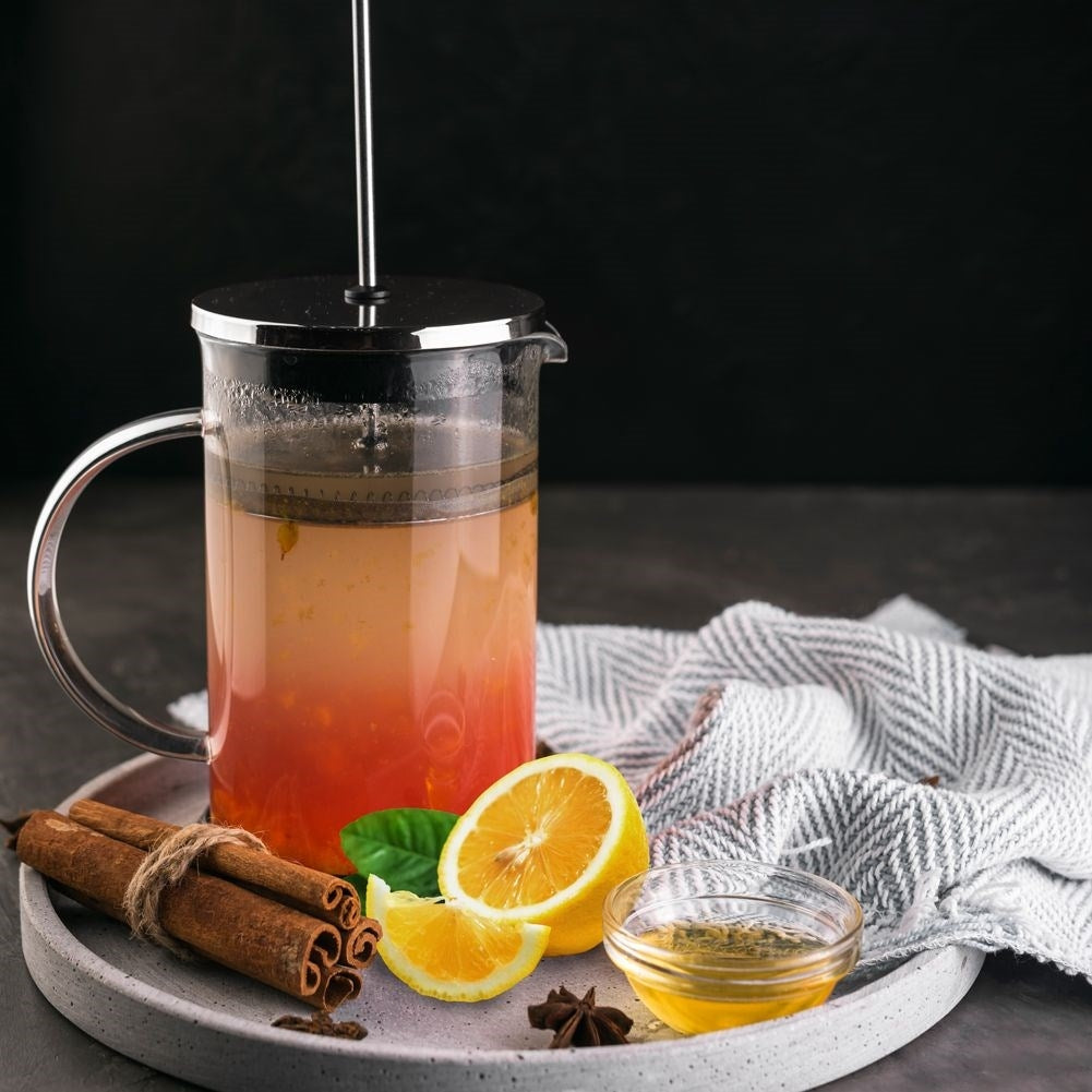 Pitcher-shaped glass brewer with strainer for coffee, tea and milk frothing