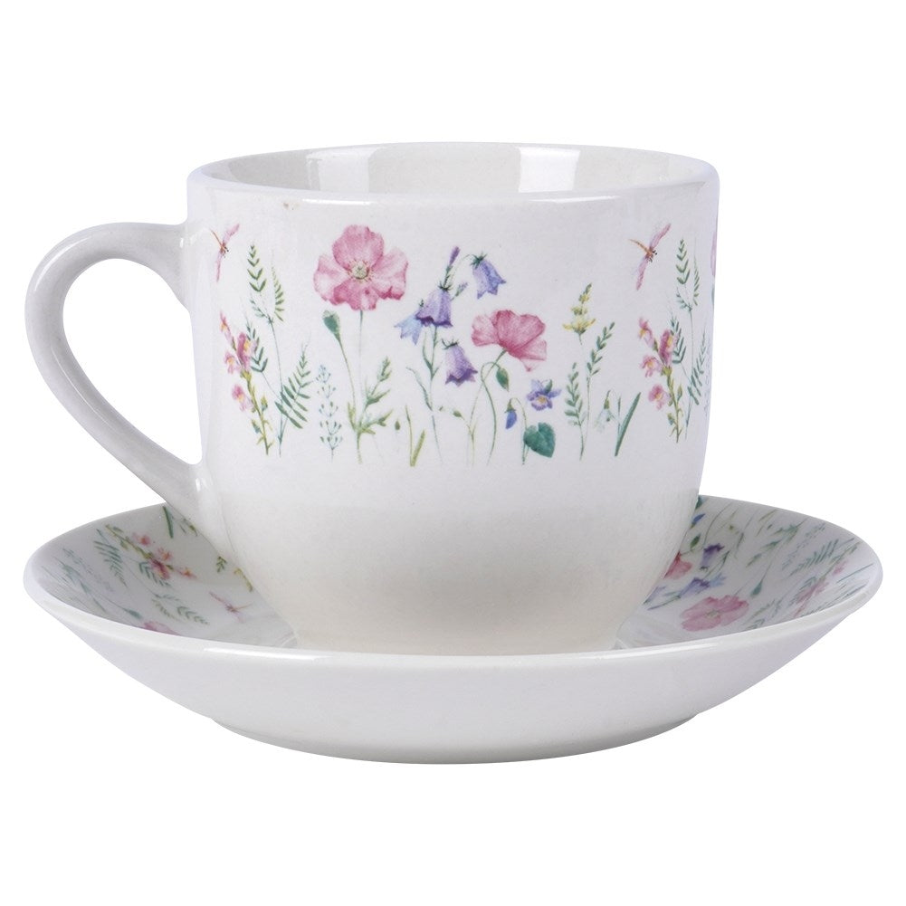 Porcelain cup with floral pattern and saucer
