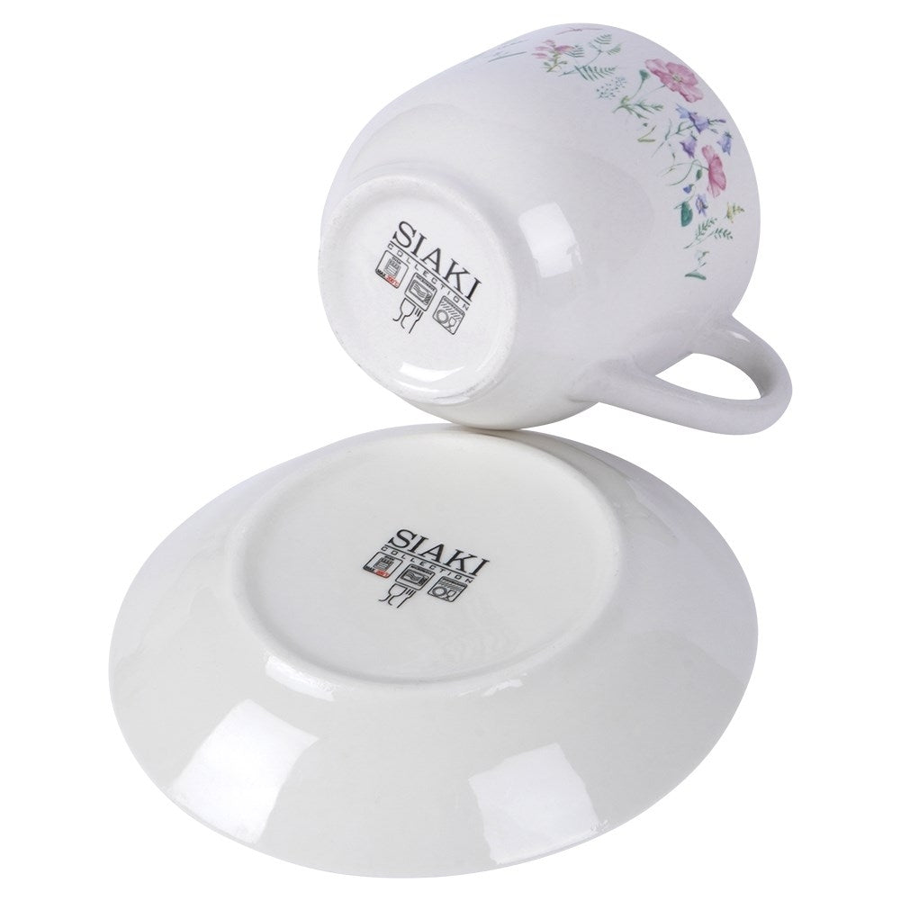 Porcelain cup with floral pattern and saucer