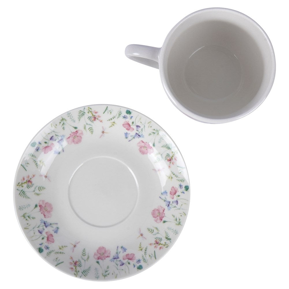 Porcelain cup with floral pattern and saucer